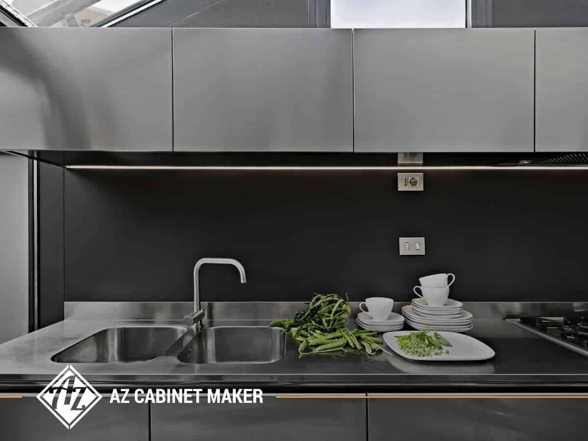 Modern metal kitchen cabinet design with sleek countertop and sink setup