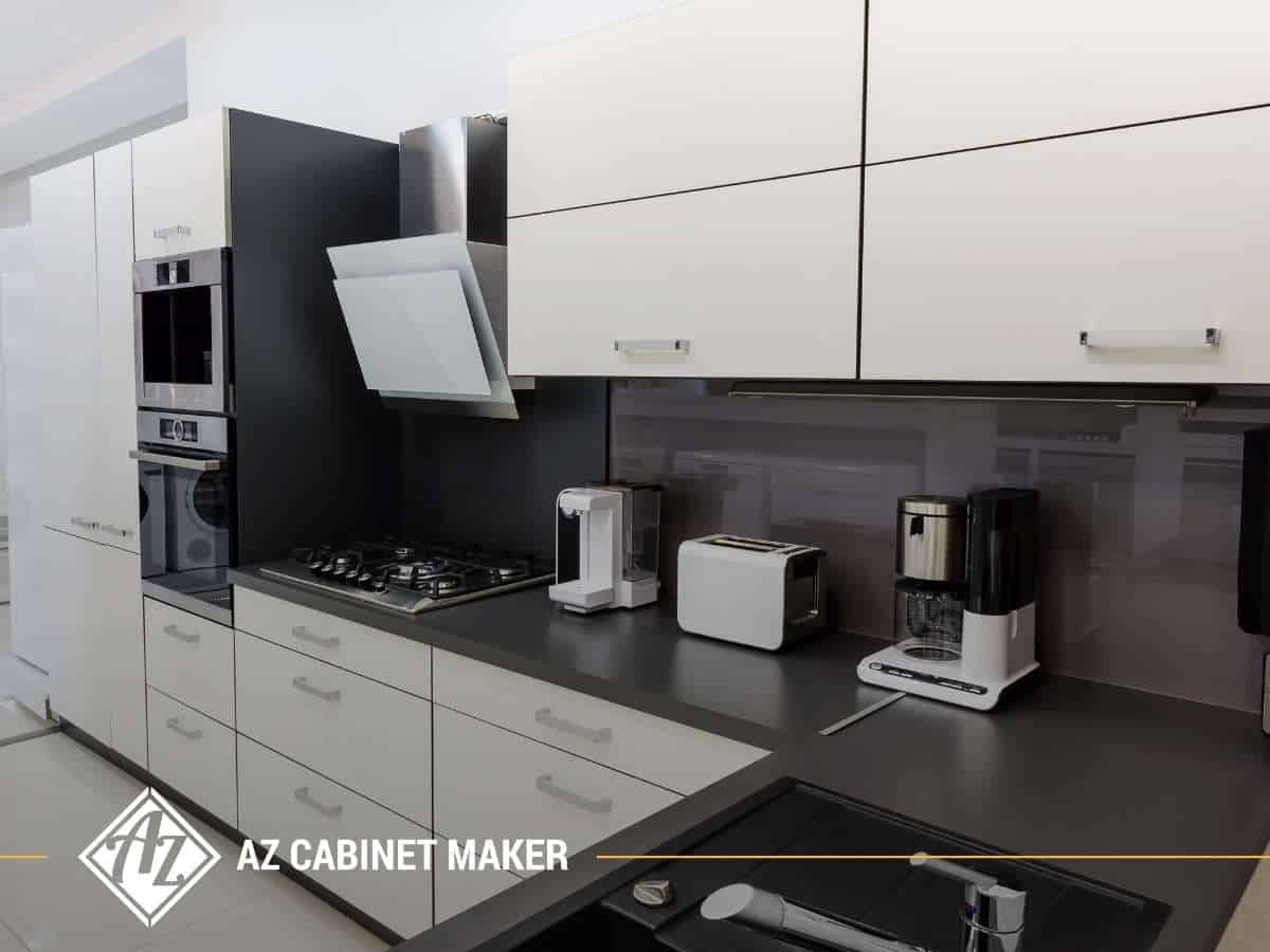 Sleek kitchen showcasing modern cabinets by AZ Cabinet Maker, with integrated appliances and contemporary design