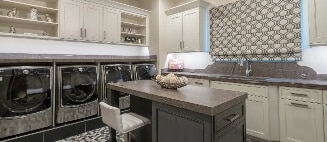 custom-laundry-room-cabinetry-with-built-in-countertop-and-storage Custom laundry room cabinetry with built-in countertop and storage